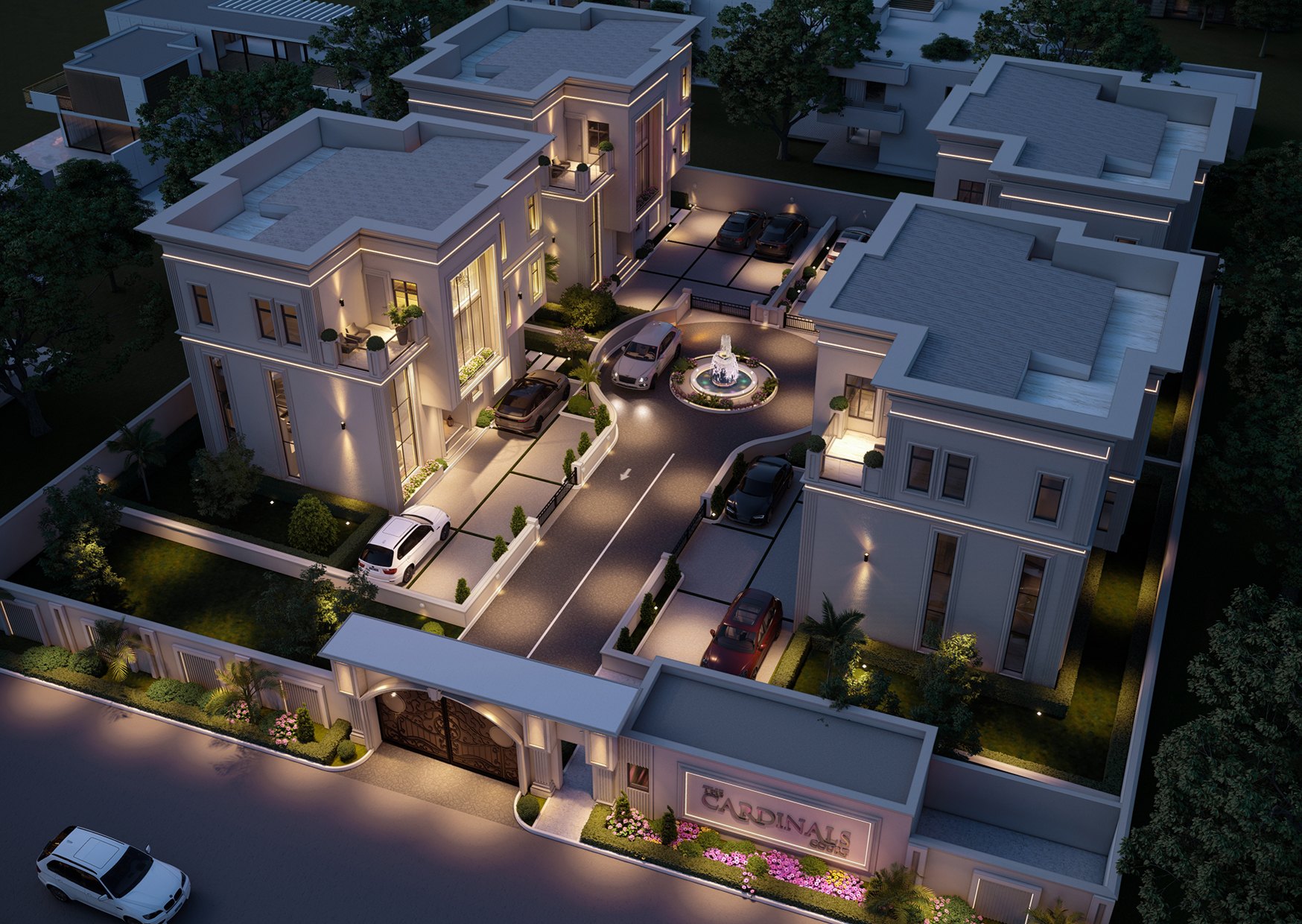 The Cardinals Court — the four detached homes, gate house and fountain court seen from above at dusk